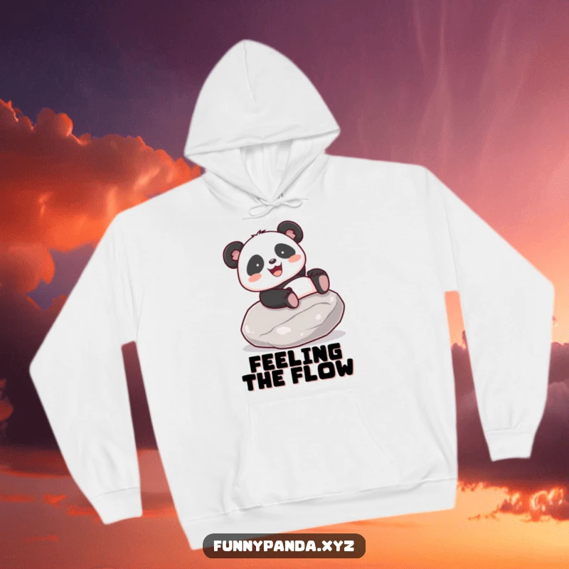 Funny kawaii panda with a joyful expression gleefully sliding down a smooth stone, featured on a cozy hoodie.